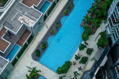 Directly above shot of swimming pool amidst buildings in city