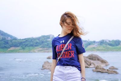 Young woman looking at sea