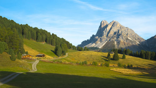 Scenic view of landscape and mountains against sky