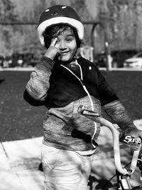 Portrait of smiling boy riding