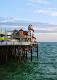 Pier over sea against sky