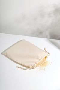 High angle view of cake on table against white background