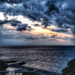 Scenic view of sea against dramatic sky