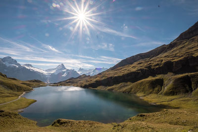 Sun shining over lake