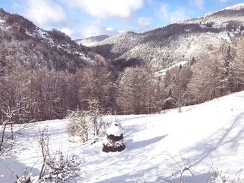 Scenic view of snowcapped mountains against sky