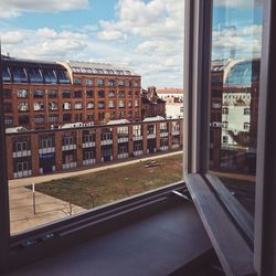 Buildings in city against sky