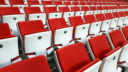 Full frame shot of empty stadium chairs