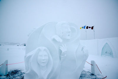 Statue against sky during winter