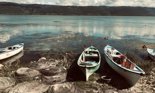 Boats moored on shore