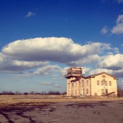 Buildings against blue sky and clouds