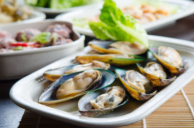 Close-up of seafood in plates on table