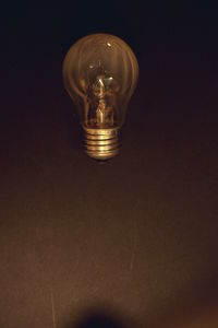 Low angle view of illuminated light bulb