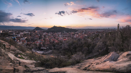 High angle shot of townscape against sky at sunset