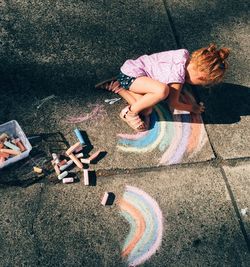 High angle view of girl playing on grass