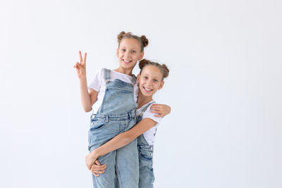 Portrait of a smiling girl over white background