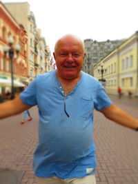 Portrait of man on street in city