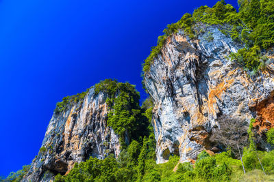 Low angle view of rock formations against sky