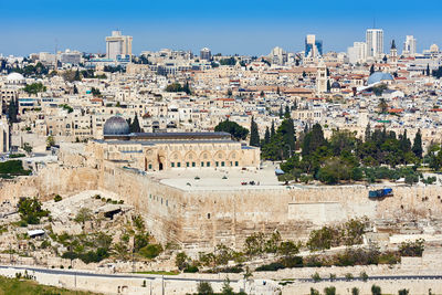 View of cityscape against blue sky