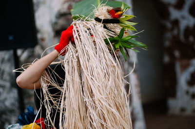 Woman with plants standing outdoors