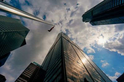 Low angle view of building against cloudy sky