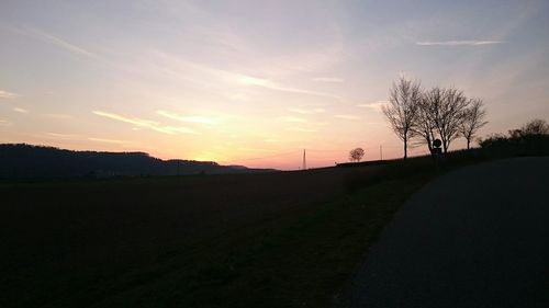View of country road at sunset