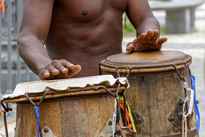 Musicians playing traditional instruments used in capoeira  from afro-brazilian culture