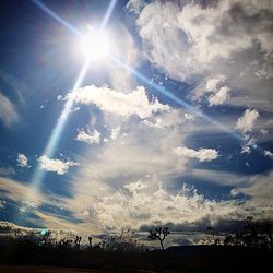 Sun shining through clouds