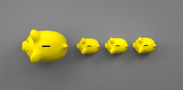 Close-up of yellow toy over white background