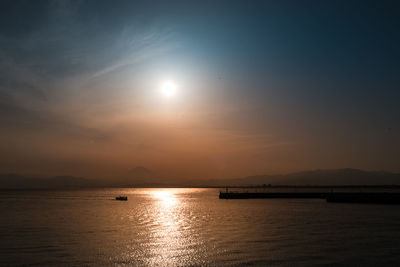 Scenic view of sea against sky at sunset