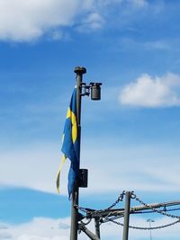 Low angle view of flag against sky