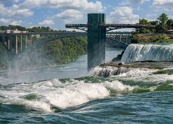 Niagara falls observation tower and rainbow bridge seen from usa.