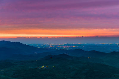 Scenic view of silhouette mountains against sky during sunset