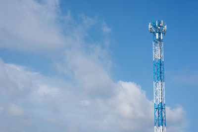 Low angle view of communications tower against sky