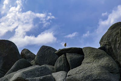 Low angle view of rock formations against sky