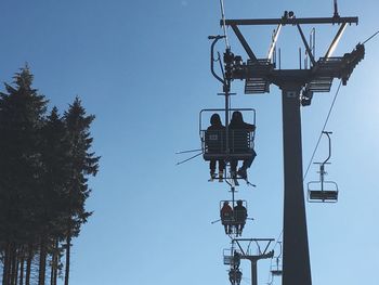 Low angle view of communications tower against sky