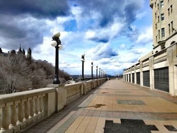 Street amidst buildings against sky