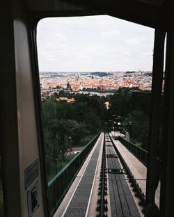 High angle view of railroad tracks seen through window