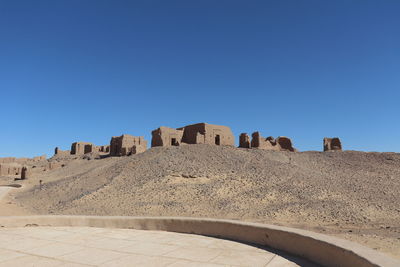 Low angle view of fort against clear blue sky