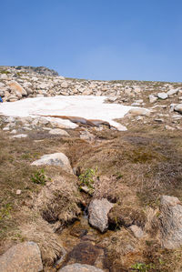 Scenic view of rocky mountains against clear blue sky