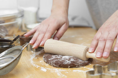 Midsection of man preparing food in kitchen