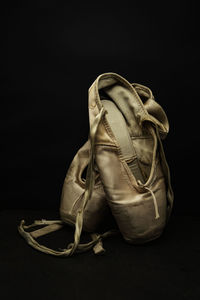 Close-up of shoes against black background