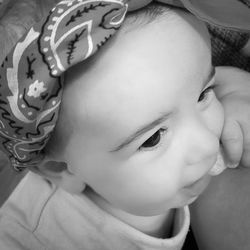 Close-up of cute baby on bed