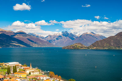 View of lake como, looking north, from musso, with alps, villages and the mountains of valtellina.