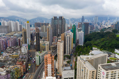 High angle view of modern buildings in city against sky