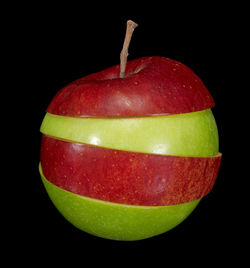 Close-up of apple against black background