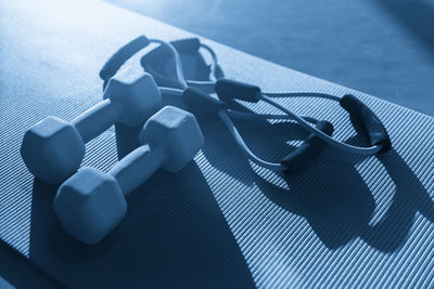 High angle view of dumbbells on table