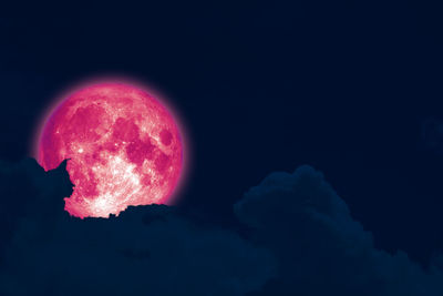 Low angle view of moon against sky at night