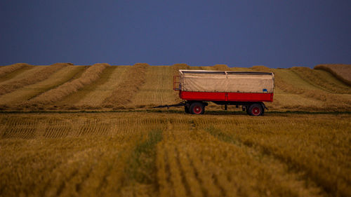 Tractor on field against sky