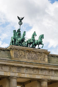 Low angle view of statue against sky