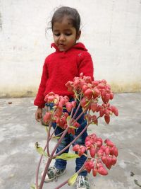 Cute girl with red flowers